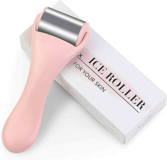 Rouleau froid pour la peau rose avec rouleau en métal pour soin facial et détente